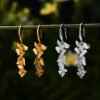 Imagem do Brinco Orquídeas em Prata 925 e Ouro 18k | ARISCA